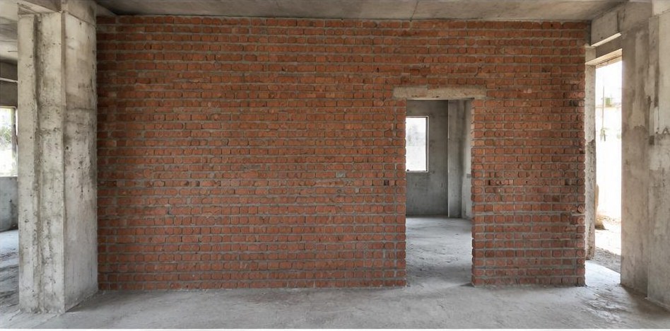 Illustrative after: Red-brick wall with a planned doorway and aligned courses.