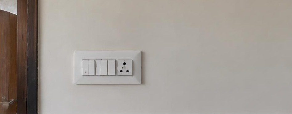 Illustrative after: New modular switch plate and repaired wall finish.