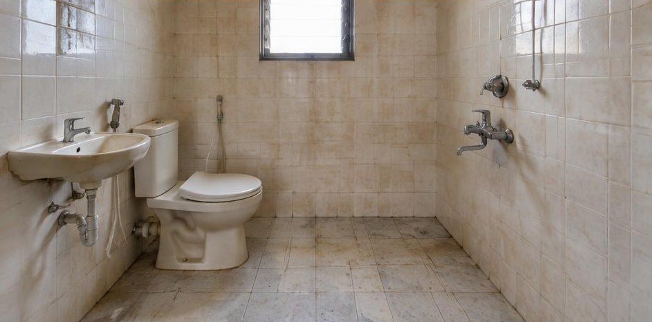 Illustrative before: Dated and stained tiles before replacement.